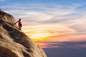 a climber climbing rocks